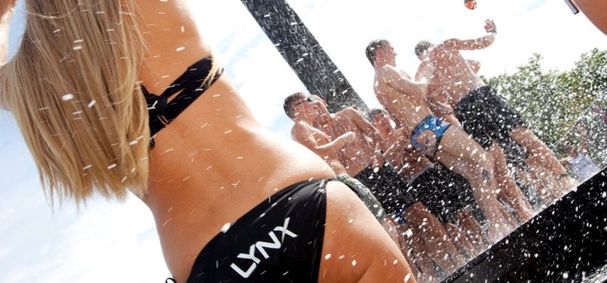 girl in bikini surrounded by swirling snow